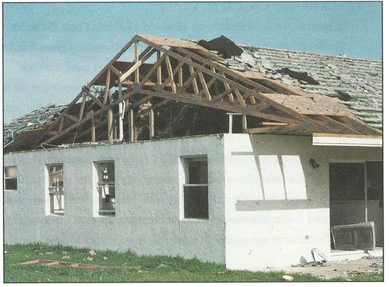 Loss of roof sheathing and roof covering.  From FEMA FIA-22, Building Performance:  Hurricane Andrew in Florida