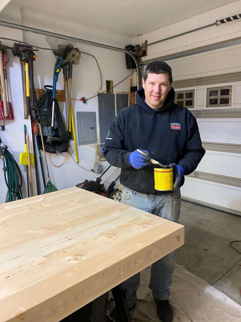 Ryan Edward staining the table