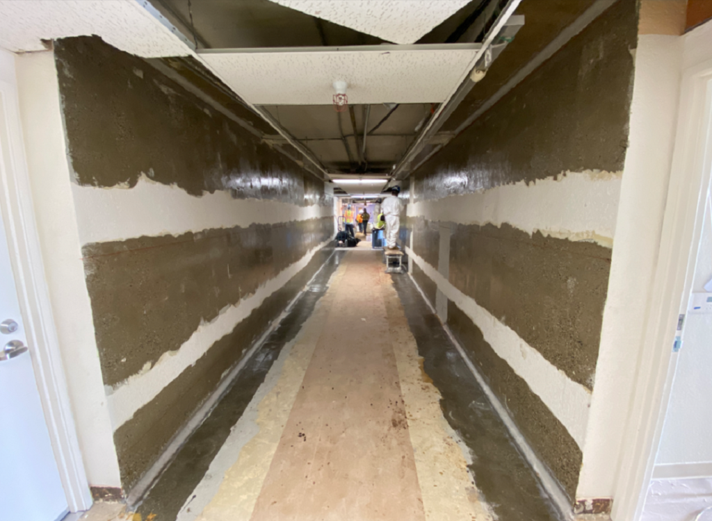 Photo 2: The surfaces of these shear walls have been prepared and epoxy resin has been applied immediately prior to placement of the horizontally oriented FRP strips.