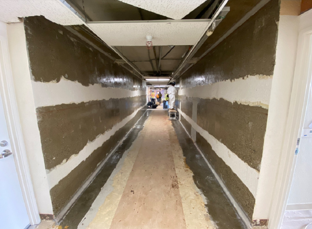 Photo 2: The surfaces of these shear walls have been prepared and epoxy resin has been applied immediately prior to placement of the horizontally oriented FRP strips. 