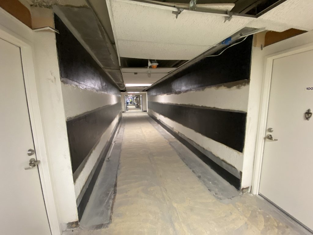 Photo 3: The carbon FRP has been installed with fibers running horizontally for the purpose of providing in-plane shear strengthening of the wall.