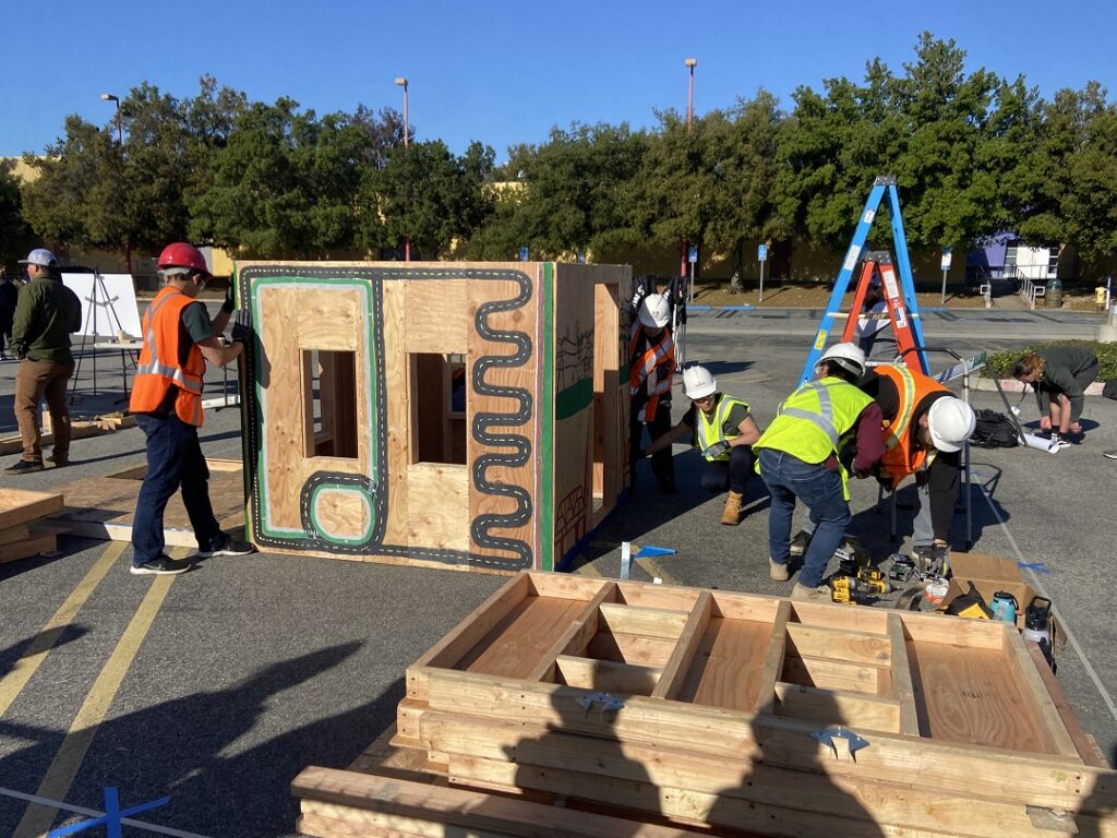 Students assembling the structure