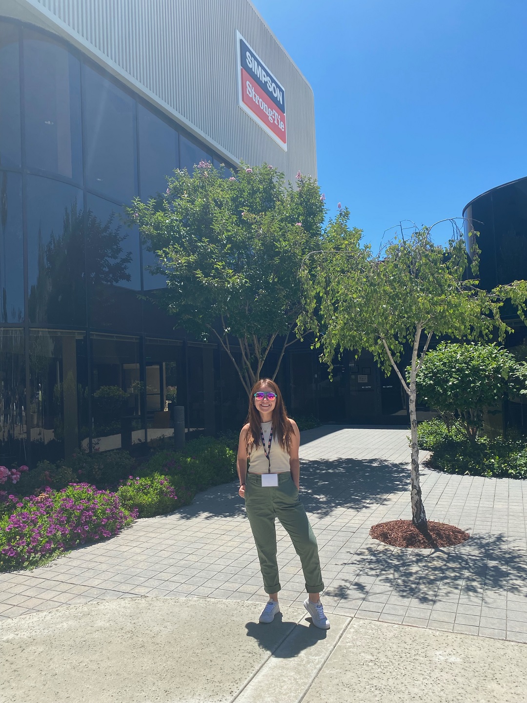 Laura posing in front of our Pleasanton California Office