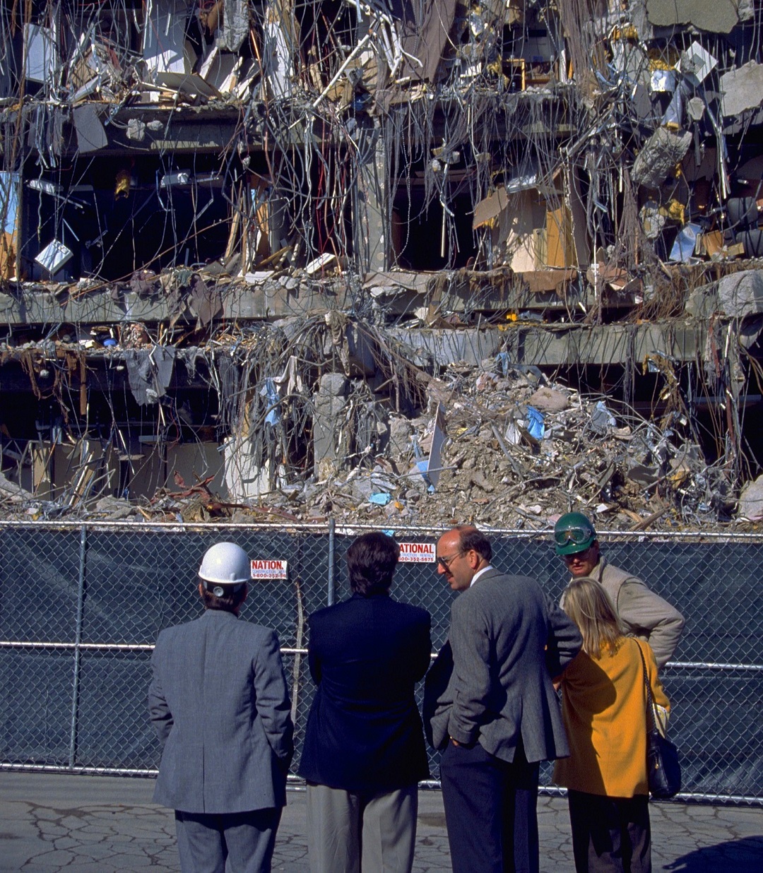 Northridge, California - January 19, 1994: Experts survey office building with one side entirely collapsed from the Martin Luther King Day earthquake.