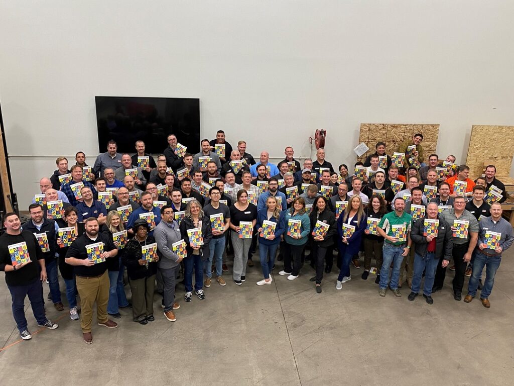 Group photo with our 2024 Connector Catalog